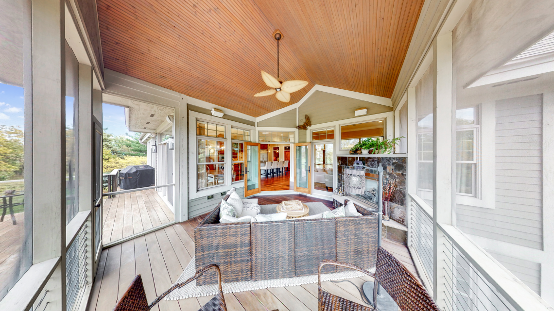 Stunning 3-season porch with gas fireplace