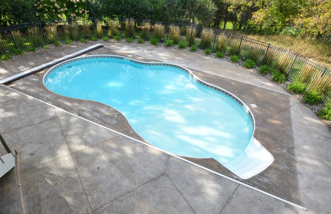 Pool with stamped concrete apron
