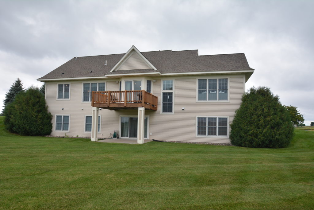 Example of a detached villa in Troy Burne Golf Village in Hudson, WI by Durham Executive Group