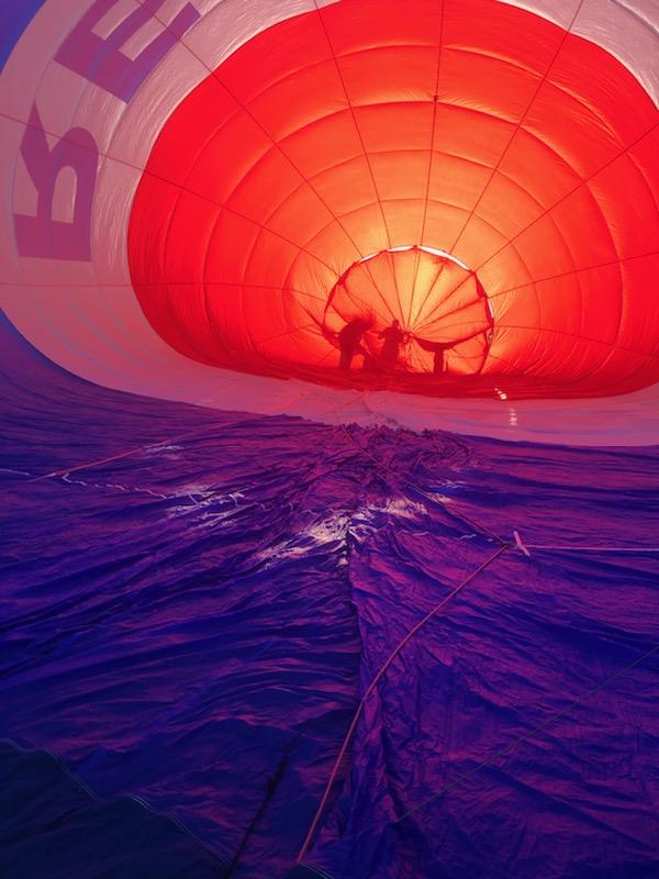 REMAX hot air balloon filling up with sunrise shining 