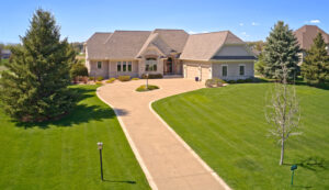 Luxury home for sale in Troy Burne Golf Village on golf course.
